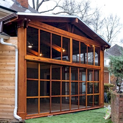 Forever Porch Pavilion (Options: 20' L x 20'-9" W, California Redwood, 2-Post Anchor Kit for High-Wind, No Electrical Wiring Trim, with 2 Fascia Boards for Gutters, 12 ft Posts Height, No Post Decorative Trims, 1 Ceiling Fan Base, No Curtain Rods, with Privacy Panels, Screened Sliding Doors and Fixed Screen Panels, Transparent Premium Sealant). Photo Courtesy of J. Pegg of Cordova, TN.